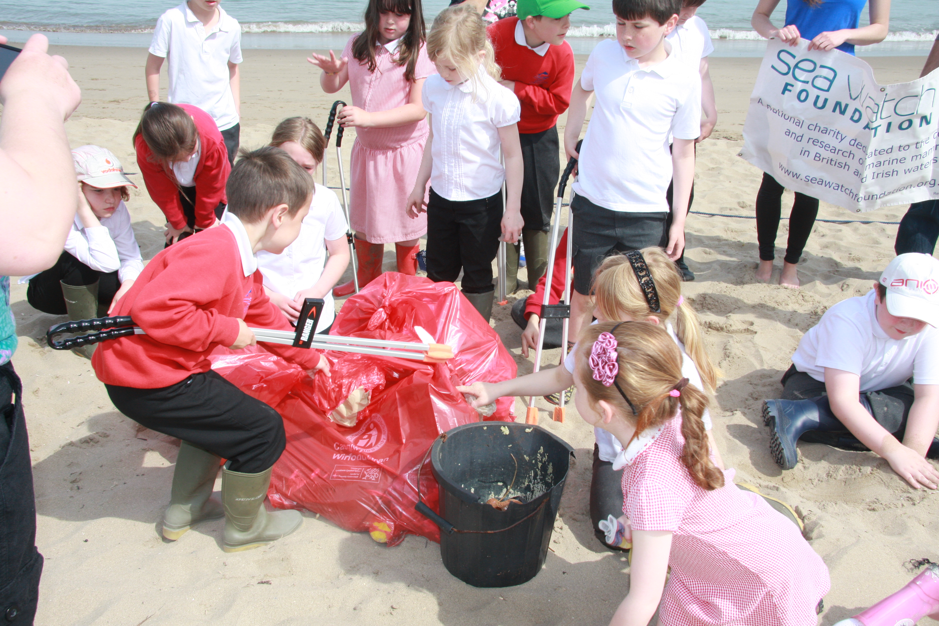 A Sea Watch beach clean with local school children.